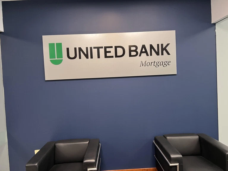 United Bank Mortgage interior lobby painting with navy accent wall by National Painting Partners