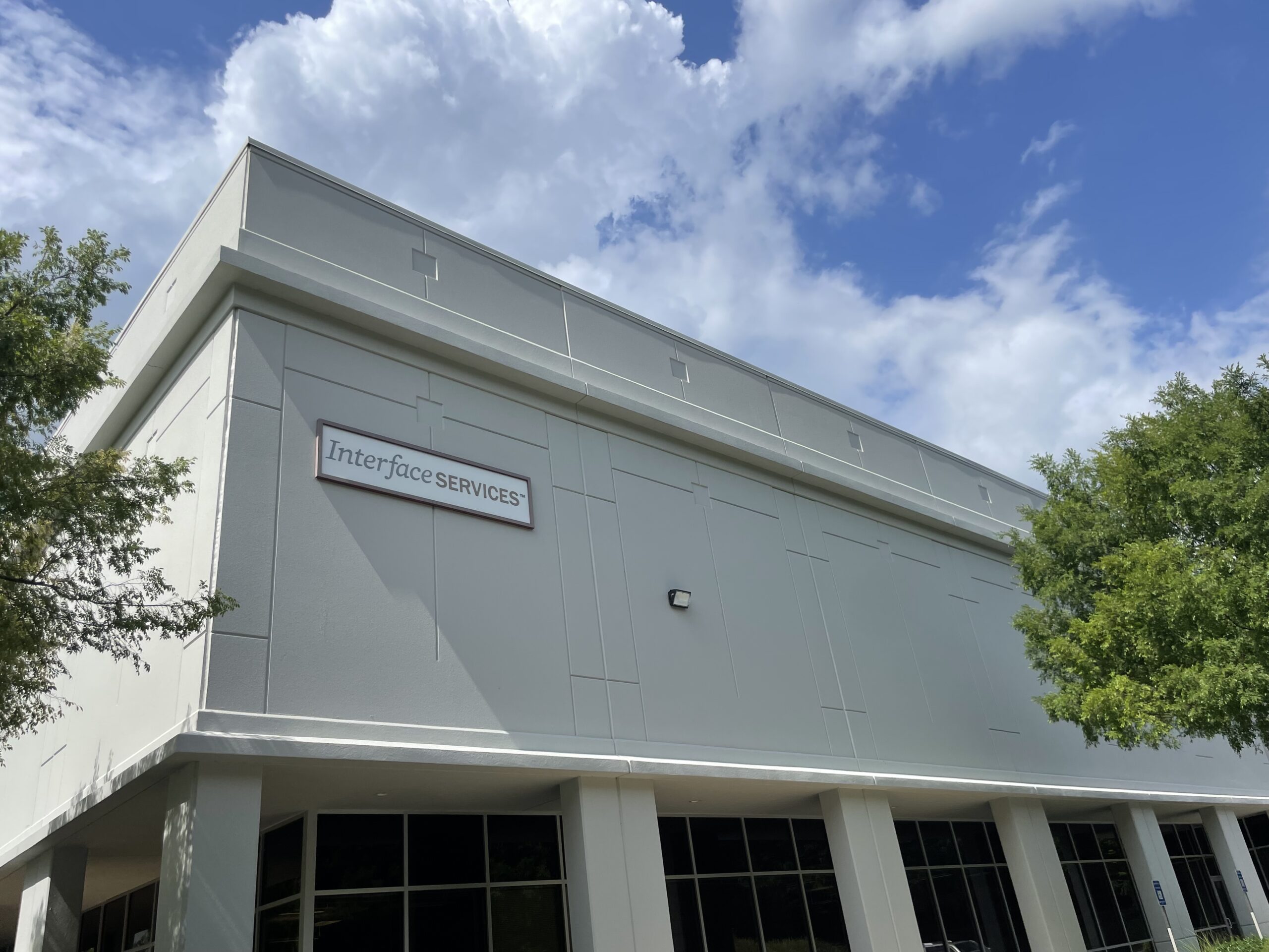 Industrial painting crew at warehouse facility