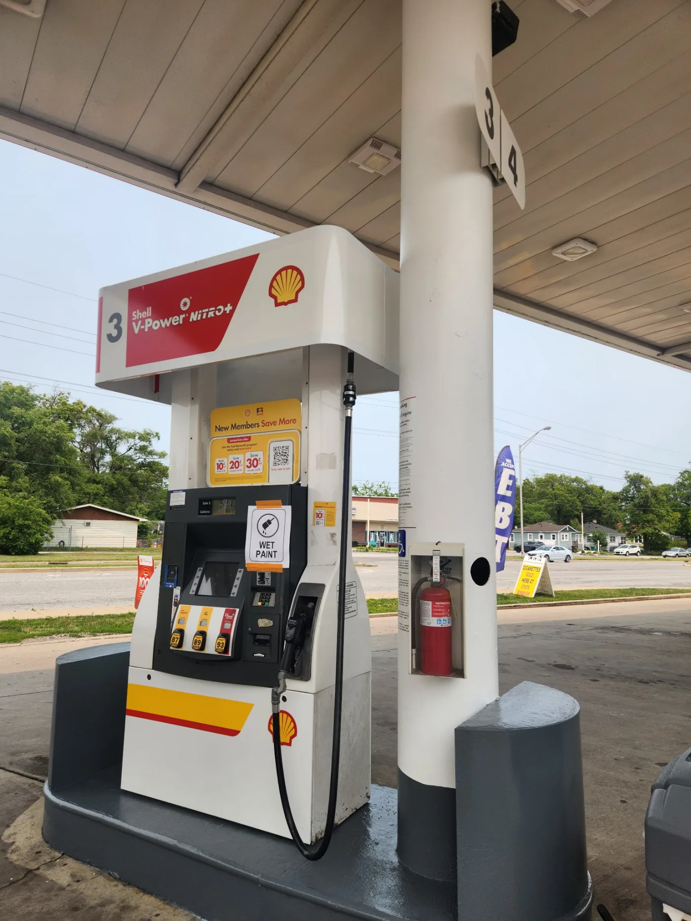 Gas station pump island painting with wet paint sign in Hobart, IN by National Painting Partners