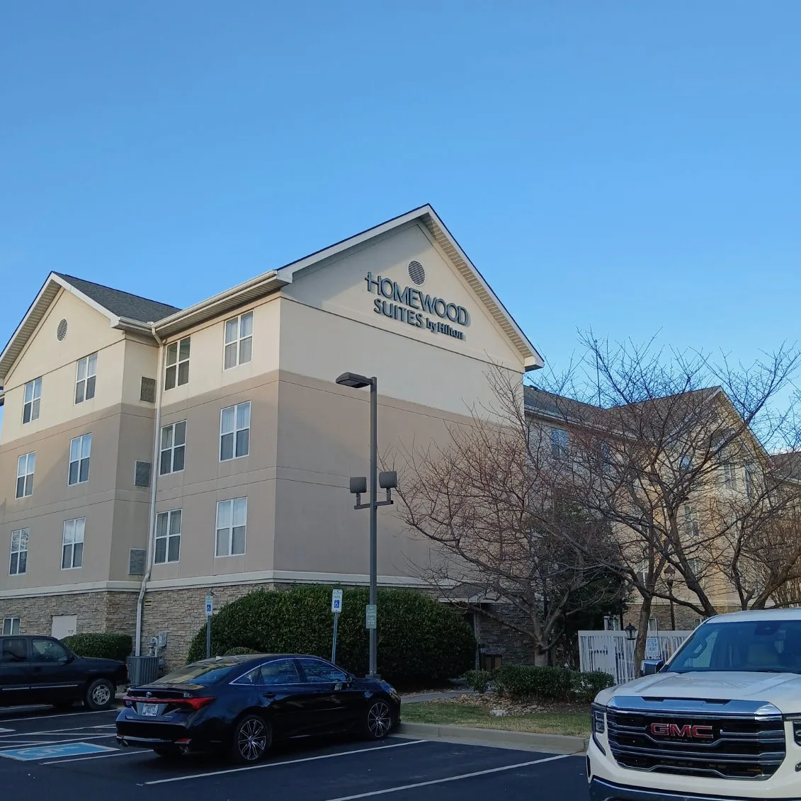 Commercial hotel exterior painting in Knoxville, TN by National Painting Partners - full exterior view