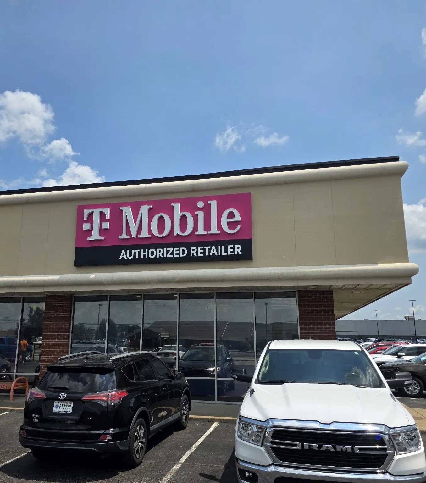 Wireless retail store exterior after commercial repainting in Evansville, IN by National Painting Partners - completed refresh (view 3)