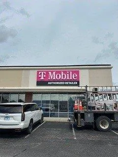 Wireless retail store exterior before commercial repainting in Evansville, IN - existing condition (view 3)