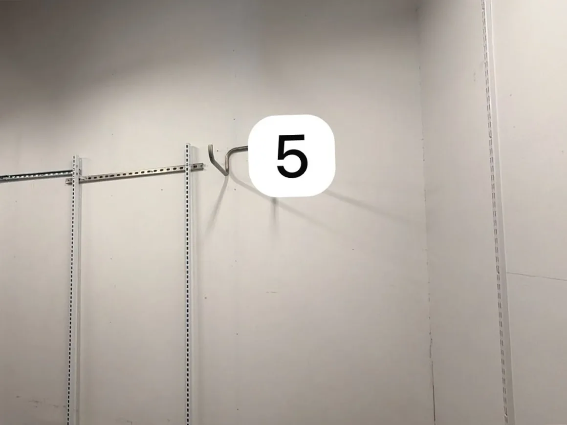 Stockroom wall 5 with racking hardware before RFID shielding paint